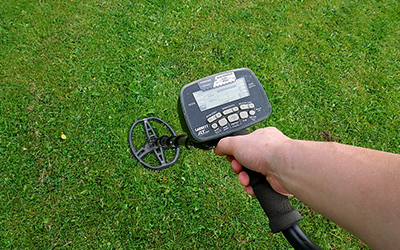 Person using a metal detector